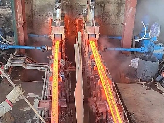 Twin glowing steel bars running out along the PSML cooling bed